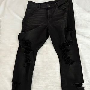 BLACK AMERICAN EAGLE RIPPED SKINNY JEANS